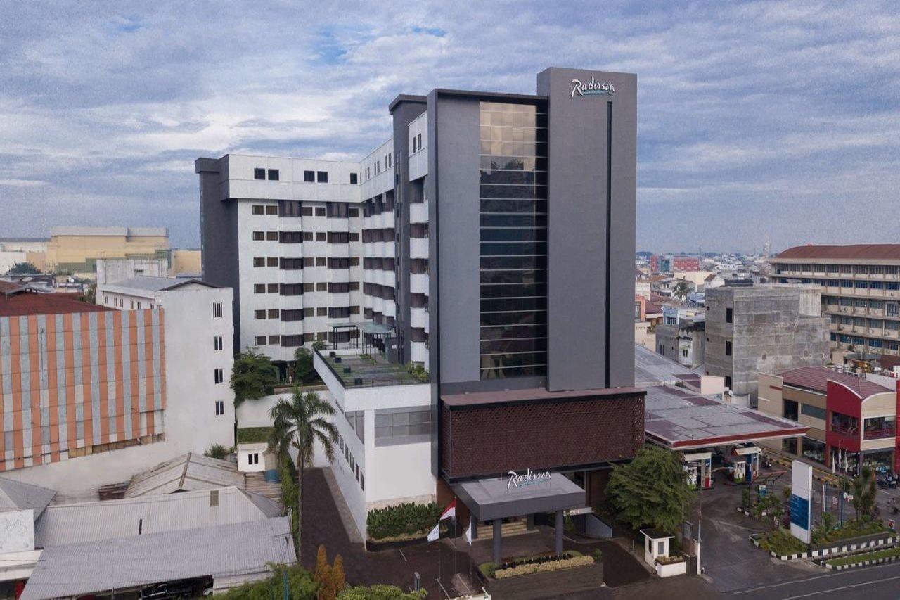 Aiho Hotel Medan Extérieur photo